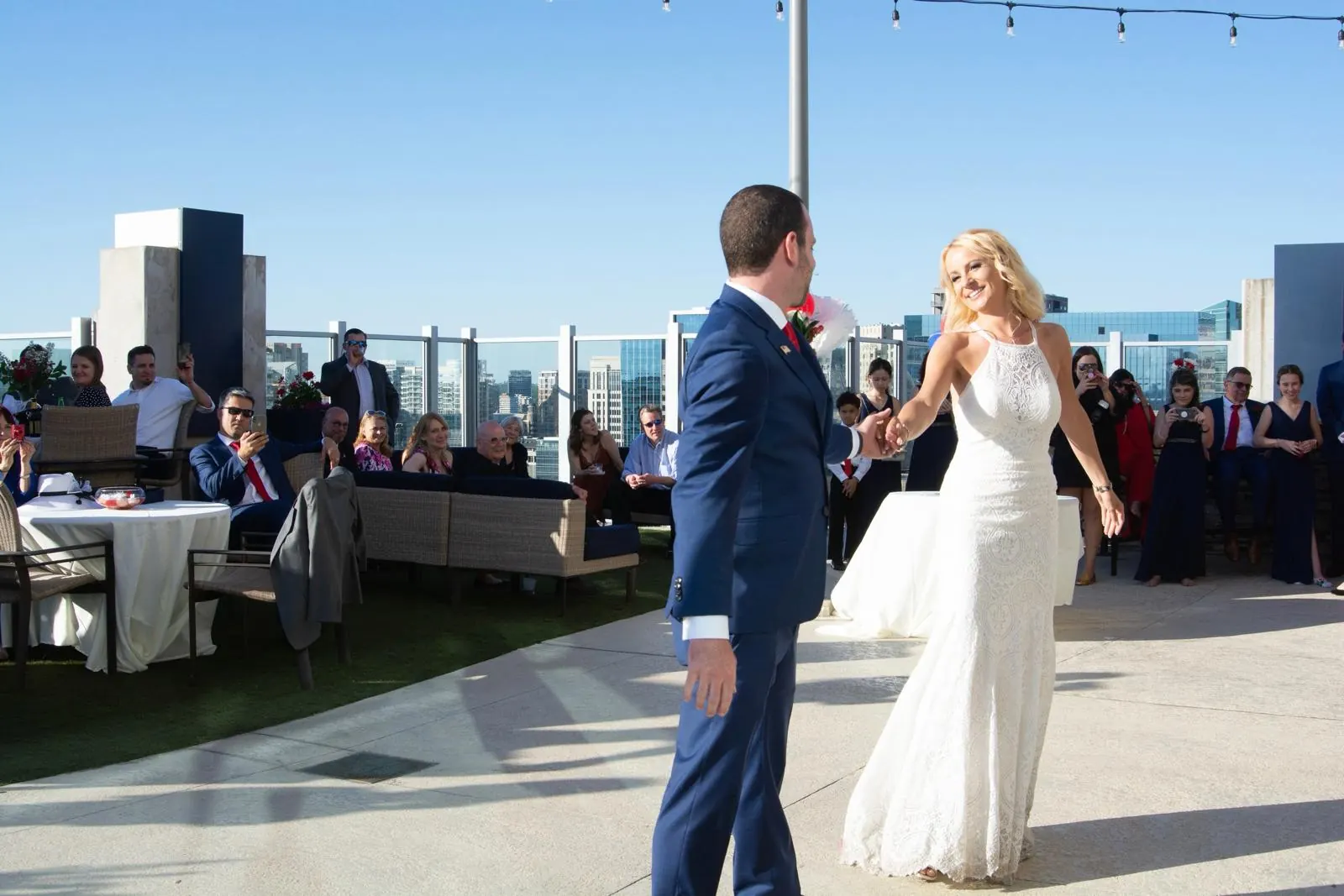 Couple dancing on a rooftop terrace at a Dallas wedding reception